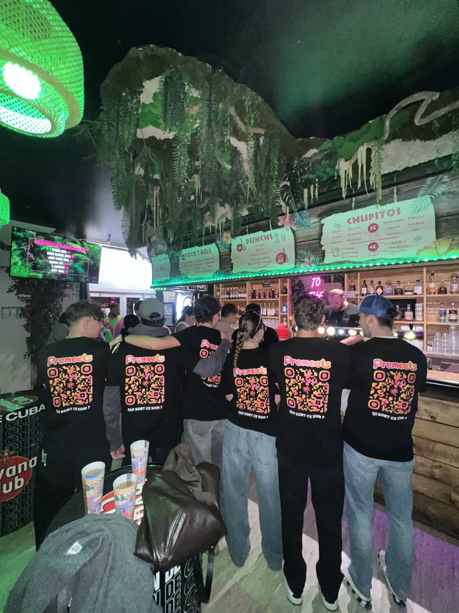 The Premeets crew in t-shirts at a bar